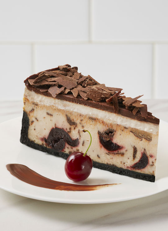 A slice of Chocolate Cherry Cheesecake