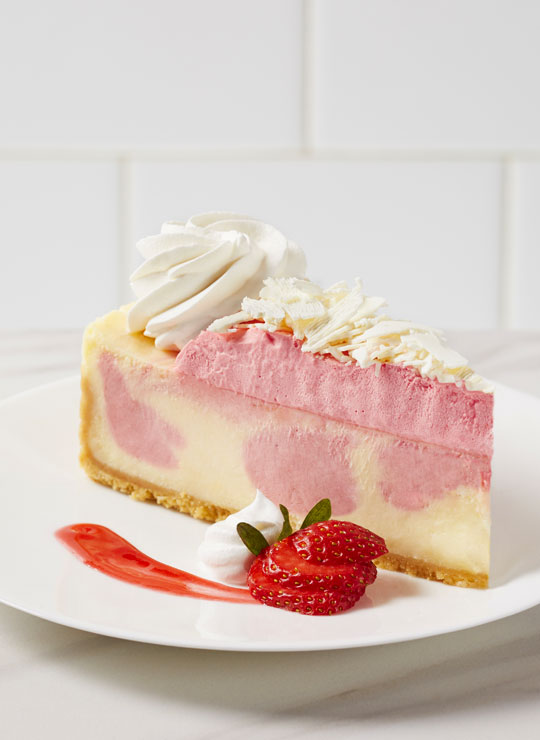 A slice of Wild Strawberries & Cream Cheesecake