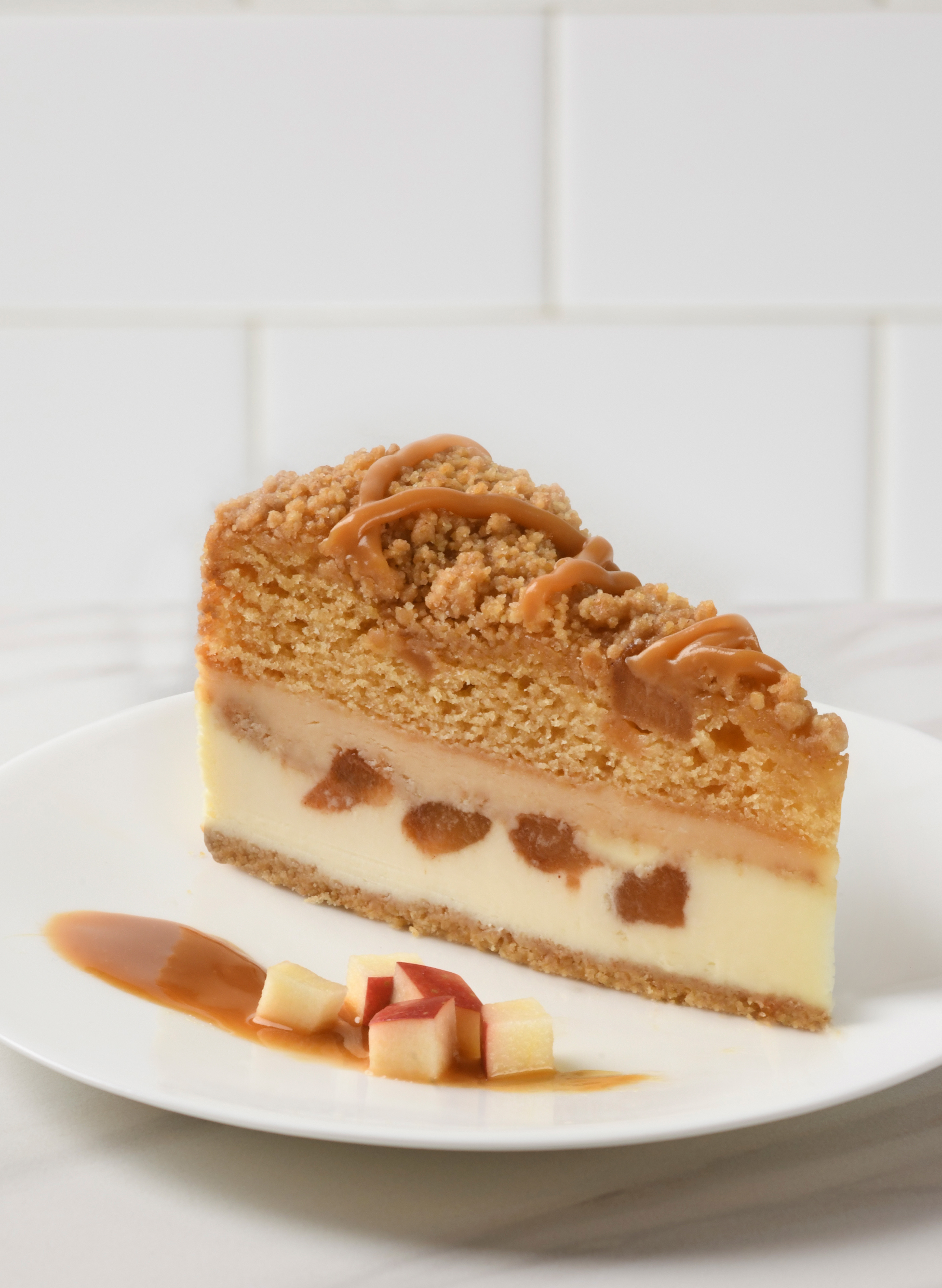 A slice of Caramel Apple Crunch Cheesecake